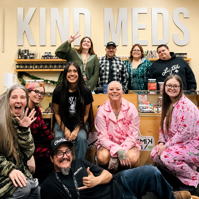 Friendly Kind Meds budtender team inside a Mesa cannabis dispensary.